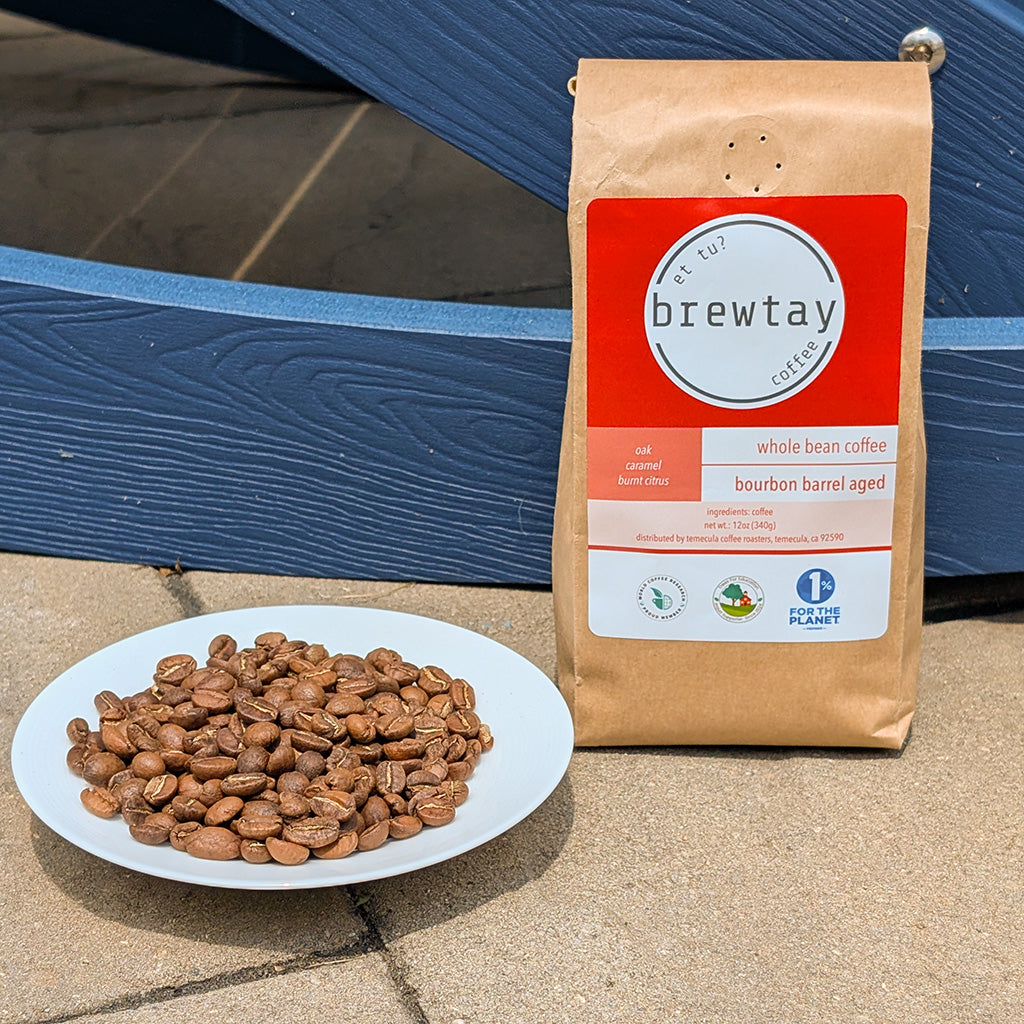 Brewtay coffee package with a plate of coffee beans on a concrete surface.