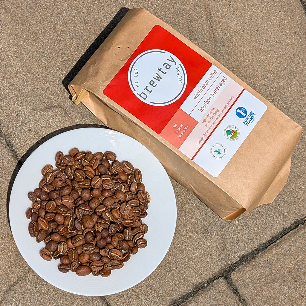 Bag of coffee beans with a label on a concrete surface