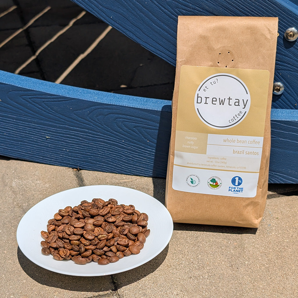 Brewtay coffee package with a plate of coffee beans on a wooden surface