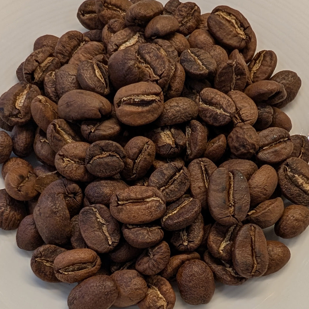 Brewtay Coffee Guatemala - Pile of roasted coffee beans on a white background