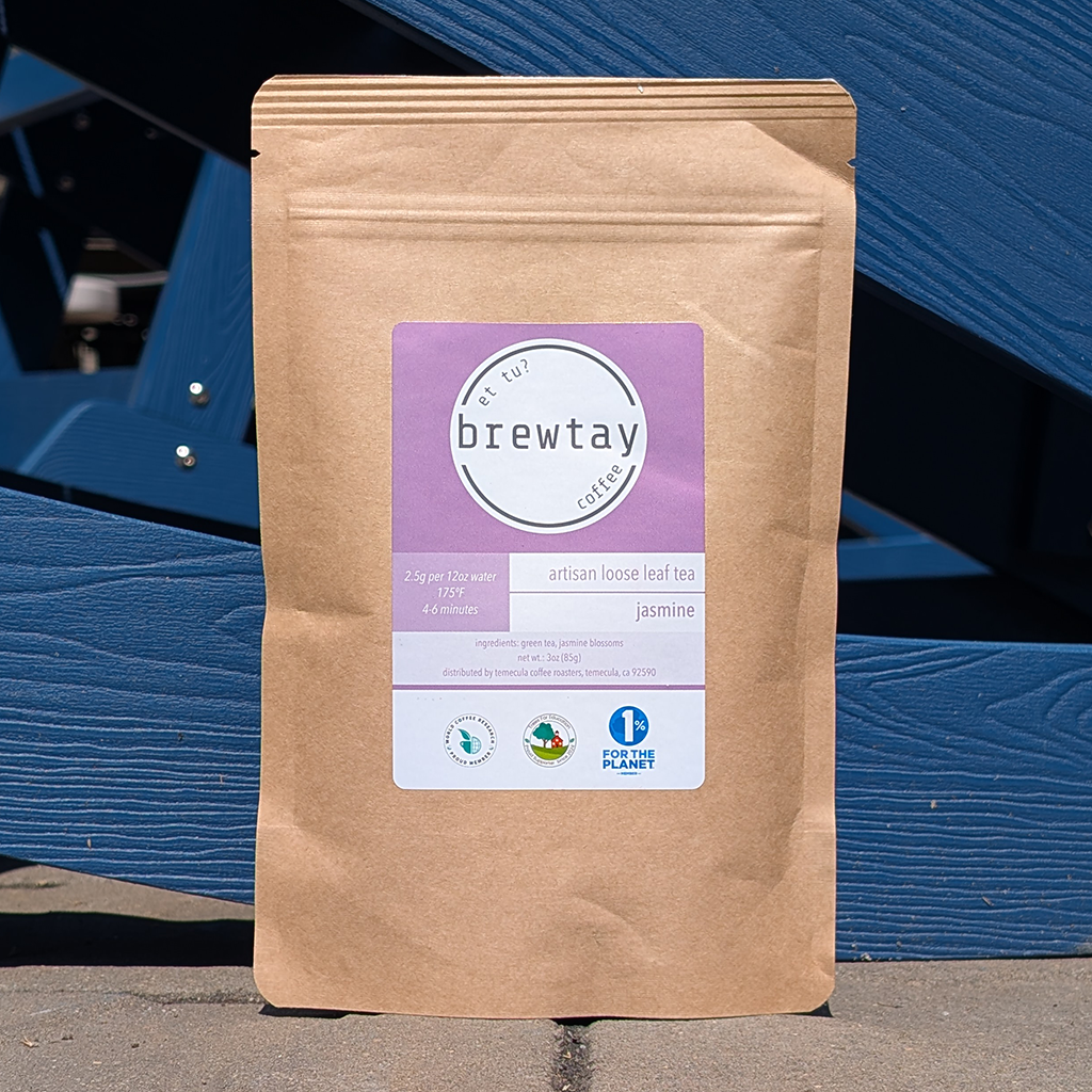 Brown paper bag with a purple label on a blue wooden background