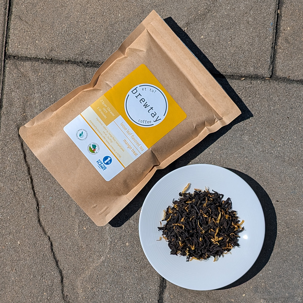 Brewway Coffee package and tea leaves on a plate on a concrete surface