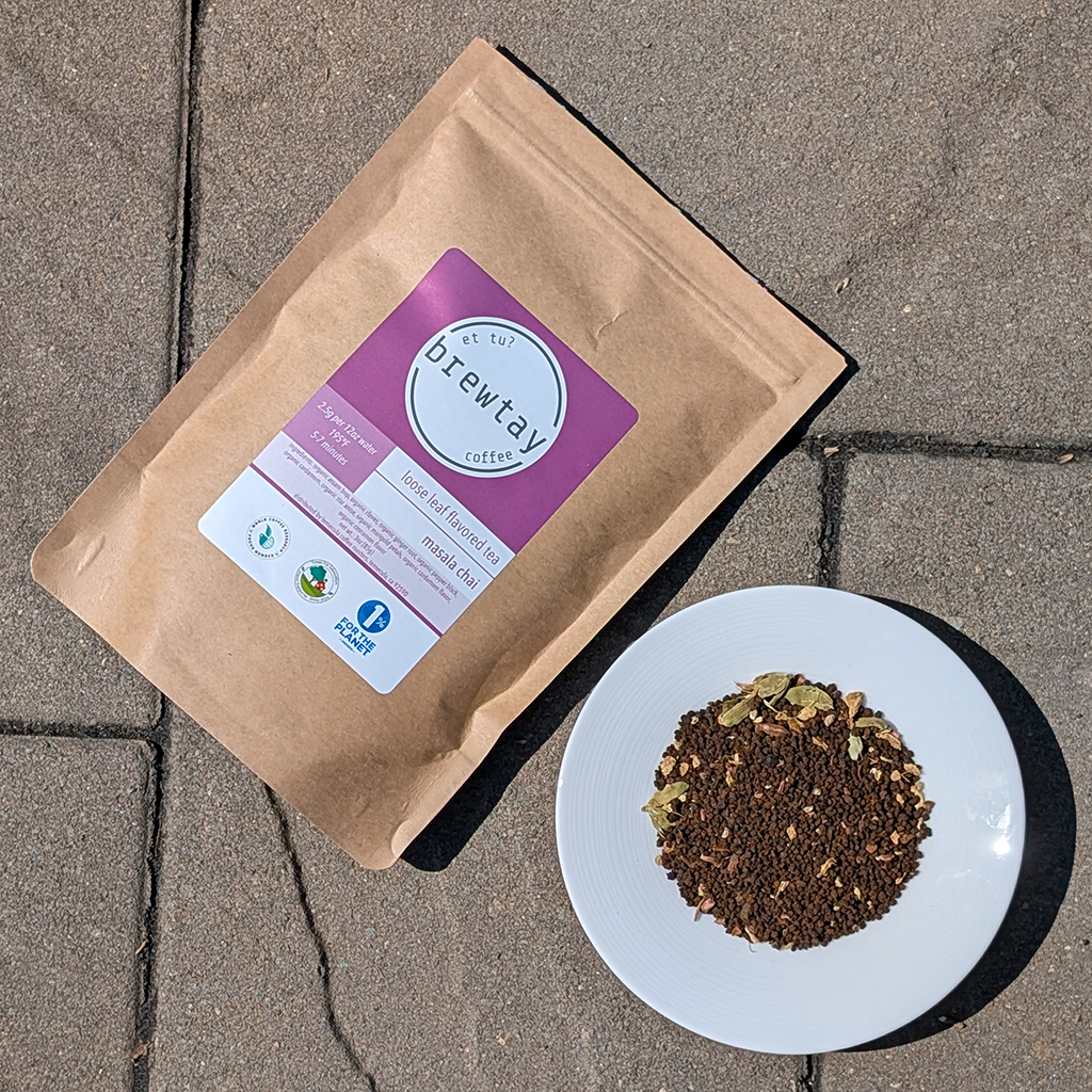 Brewtay coffee package and a plate of tea leaves on a concrete surface