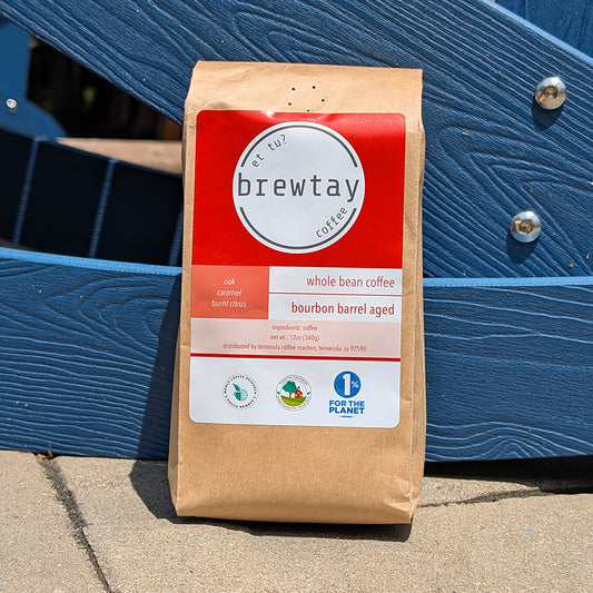 Brewtay coffee bag with red label against a blue metal background