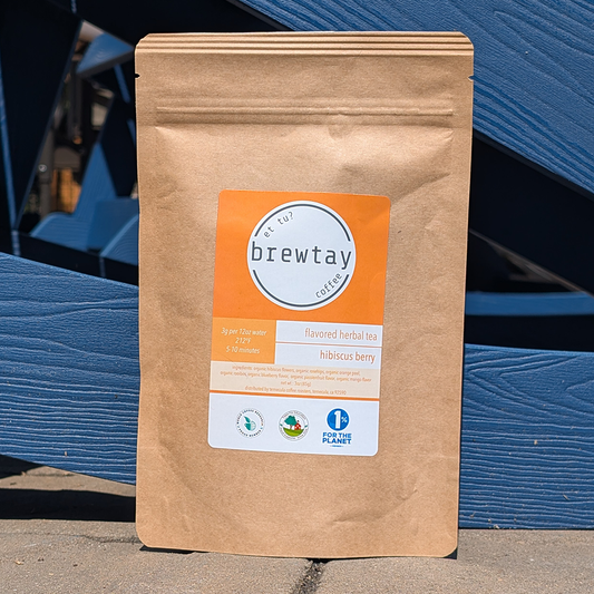 Brown paper tea bag with Brewtay label against a blue background