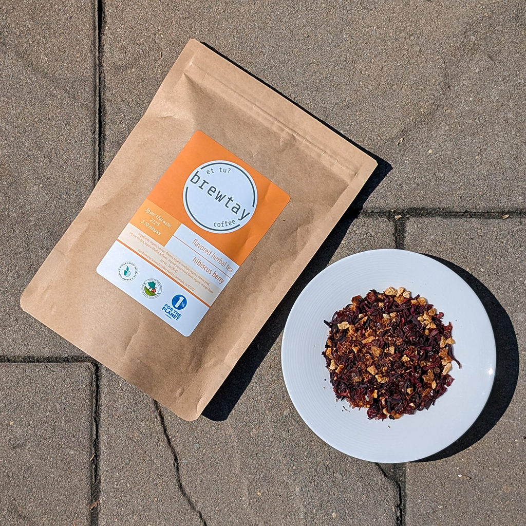 Brewway coffee package and a plate of ground coffee on a stone surface